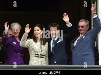 The royal engagement between HRH crown prince Frederik and Mary Donaldson. This is the first pictures of them together since the engagement was official. The happy couple are waving to the crowd from the balcony of Amalienborg Palace alonside Queen Margrethe and Prince Henrik. Stock Photo