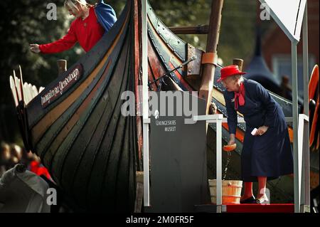 Queen Margrethe of Denmark christens a replica of a 1,000-year-old Viking sailing vessel in Roskilde, Denmark. It was named ' The Sea Stallion of Glendalough'. Plans are for a crew of 60 men to sail the vessel, which builders say is the world's longest Viking ship reconstruction, to Britain and Ireland in 2007 along the routes once used by marauding Norsemen. Stock Photo