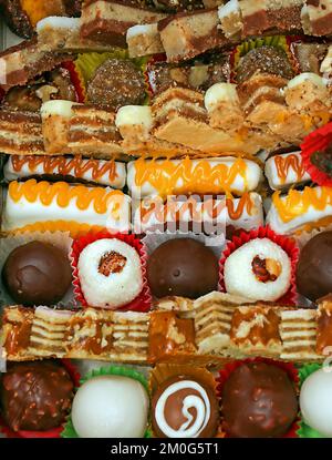 Tasty sweet chocolate cake pieces decorated on a plate Stock Photo