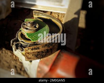 broken cutting wheel on angle grinder closeup shot. Stock Photo