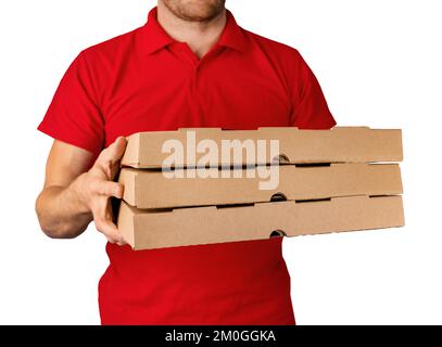 delivery man in red uniform with pizza boxes in hands isolated on white background Stock Photo
