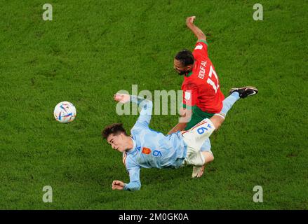 Spain's Gavi (left) and Morocco's Sofiane Boufal battle for the ball during the FIFA World Cup Round of Sixteen match at the Education City Stadium in Al-Rayyan, Qatar. Picture date: Tuesday December 6, 2022. Stock Photo