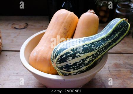 Freshly cut marrows reading on an old kitchen work surface - John Gollop Stock Photo