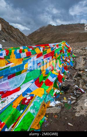 Praying flags and stones on a mountain pass, Kailash Kora, Western Tibet, Asia Stock Photo