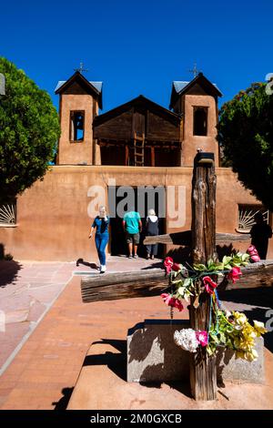 Tourists explore the Santurario de Chimayo; Chimayo, New Mexico, USA. Stock Photo