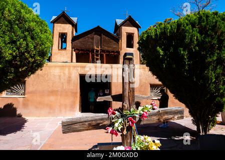 Tourists explore the Santurario de Chimayo; Chimayo, New Mexico, USA. Stock Photo