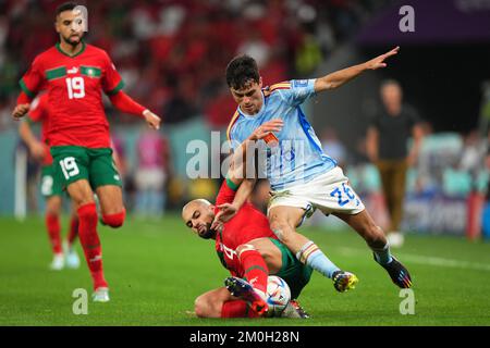 Pedro Gonzalez Pedri of Spain and Sofyan Amrabat of Morocco during the FIFA World Cup Qatar 2022 match, Round of 16, between Morocco v Spain played at Education City Stadium on Dec 6, 2022 in Doha, Qatar. (Photo by Bagu Blanco / PRESSIN) Stock Photo