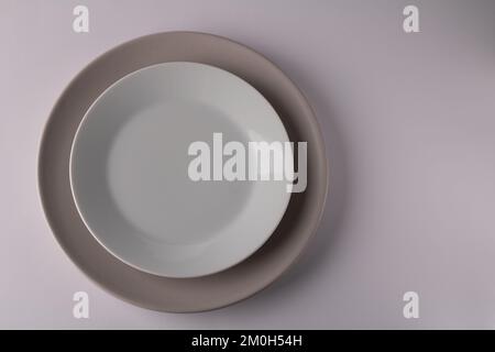 photo empty two plates view from above. The plates are on the left side Stock Photo