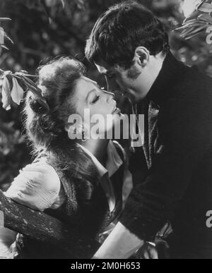 Ava Gardner, Ian McShane, on-set of the British Film, 'The Devil's Widow', aka 'Tam-Lin', American International Pictures, 1970 Stock Photo