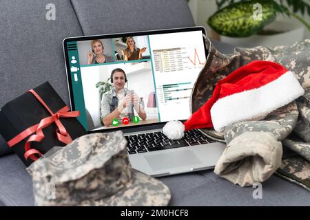 military uniform and laptop with video chat Stock Photo