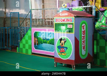 28 november, raipur, india Ticket Counter booth to buy tickets of rides in indian fun fair at night, ticket booth in indian fair, amusement park ticke Stock Photo