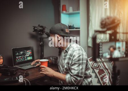 Content creator on social media working in the house studio Stock Photo
