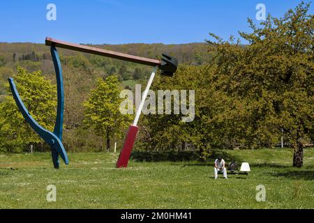 Germany, Bade-Wurtemberg, Weil am Rhein near Basel, the Vitra Campus, the sculpture Balancing Tools (1984) by Claes Oldenburg and Coosje van Bruggen Stock Photo