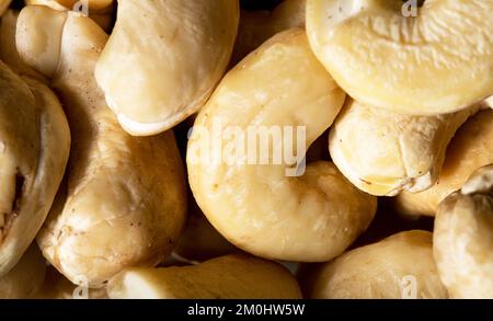 Cashew nut texture as background. Close up shot of cashew nuts. Macro photo. Stock Photo