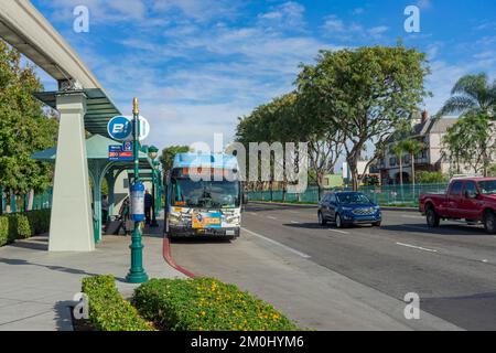Anaheim, CA, USA – November 1, 2022: A Orange County Transit Authority (OCTA) city bus at the Disneyland stop on Harbor Blvd in Anaheim, California. Stock Photo