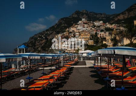 The colourful houses, shops and hotels of Positano layered vertical on the cliffs overlooking marina grande beach Italy. Stock Photo
