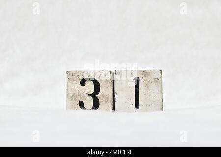 31 vintage wooden block calendar number on white snow background, copy space for text. Save the date for birthday, anniversary, special day or occasio Stock Photo