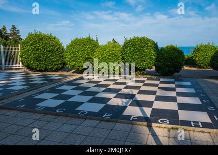 Huge chess figures on floor outdoor Stock Photo