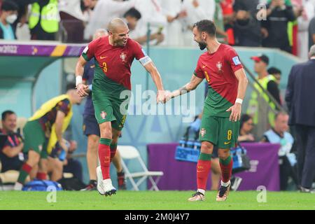 Lusail, Qatar. 06th Dec, 2022. Kepler Pepe of Portugal scores from a header and celebrates with Bruno Fernandes of Portugal during the FIFA World Cup Qatar 2022 round of 16 match between Portugal and Switzerland at Lusail Stadium, Lusail, Qatar on 6 December 2022. Photo by Peter Dovgan. Editorial use only, license required for commercial use. No use in betting, games or a single club/league/player publications. Credit: UK Sports Pics Ltd/Alamy Live News Stock Photo