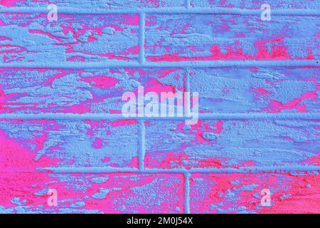 Pink or purple and light blue abstract paint pattern surface brick wall texture background. Stock Photo