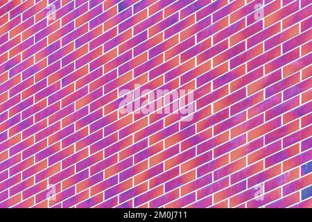 Diagonal, geometric modern pink purple paint brick wall building facade texture exterior background. Stock Photo