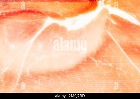 Parma ham texture as a background. A close shot of Parma ham. Macro photo.Parma ham. Stock Photo