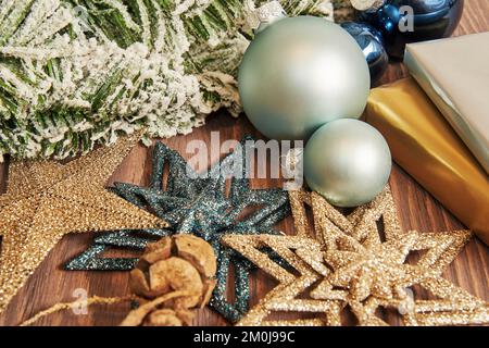 Christmas composition with snowy fir branch with blue balls and stars and gifts. Ornate New Year's decoration template Stock Photo