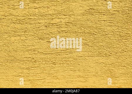 Yellow abstract light plaster bright wall pattern vibrant texture stucco background. Stock Photo