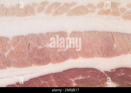 Raw bacon texture as a background. A close shot of raw bacon. Macro photo.bacon. Stock Photo