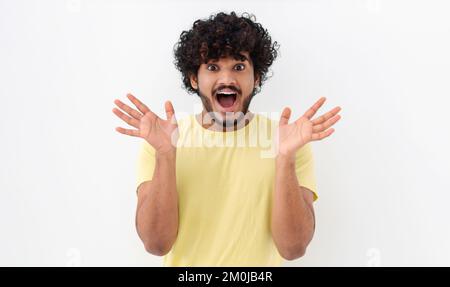 excited young Indian man with curly hair have good mood feel happy excited emotion on a white background Stock Photo