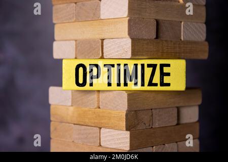 Optimism Word Written In Wooden Cube. Stock Photo