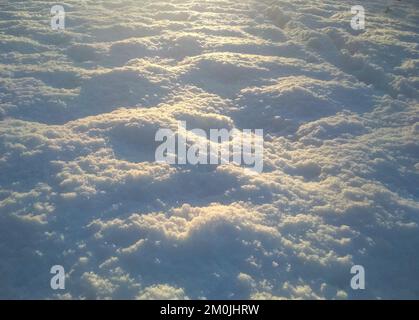 High angle view of snow texture. White clean shiny snow background texture. fresh snow seamless texture. snowy surface closeup Stock Photo