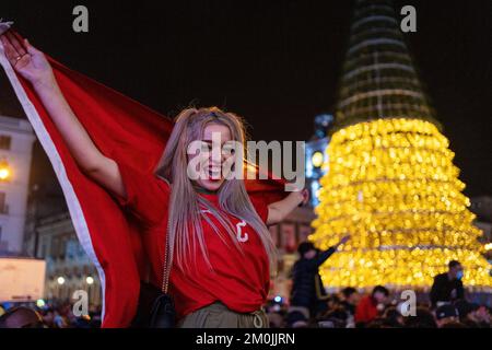 Madrid, Spain, 6th Dec 2022. Morcco supporters wildly celebrating in 'Plaza del Sol' their national team win over Spain in Football World Cup 2022 in Qatar. Police was in high alert for possible disorders. Credit: Roberto Arosio/Alamy Live News Stock Photo