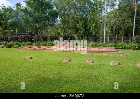 View of the common grave with low set memorial to Darwin Post Office personnel who were killed during the first Japanese air raid on February 1942 Stock Photo