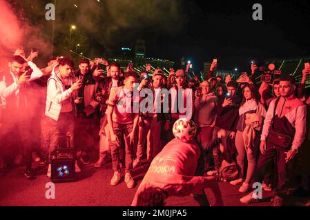 Barcelona, Spain. 06th Dec, 2022. A Moroccan man holds a ball in Las Ramblas, as others take pictures and film him during the celebration of Spain's elimination from the World Cup in Qatar. (Photo by Ximena Borrazas/SOPA Images/Sipa USA) Credit: Sipa USA/Alamy Live News Stock Photo