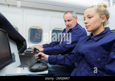 beautiful blonde woman using a pilot simulator Stock Photo