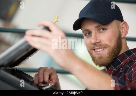 trying to repair the office printer Stock Photo