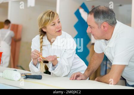young house painter and decorator apprentice Stock Photo