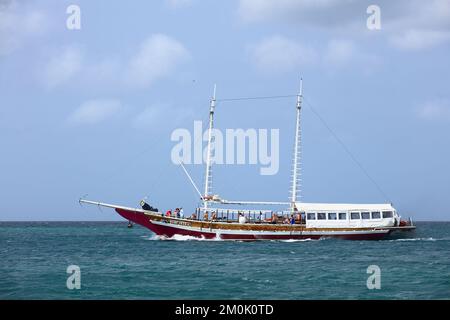 ORANJESTAD, ARUBA - MARCH 27, 2022: Monforte III ship offering luxury lagoon and exclusive dinner cruises, sailing in Oranjestad, Aruba Stock Photo