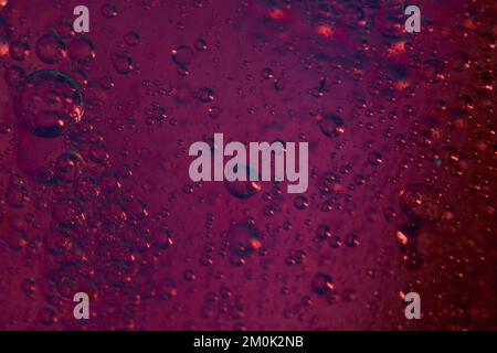 Red pink rising bubbles in different sizes from small to medium Stock Photo