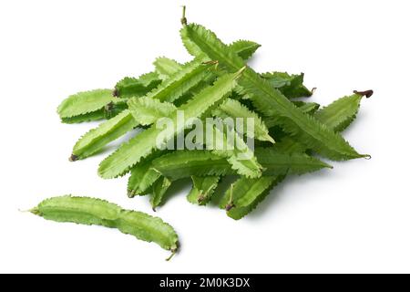 pile of winged beans, also known as cigarillas, manila or four-angled or goa beans, asparagus pea, tropical legume vegetable isolated on white Stock Photo