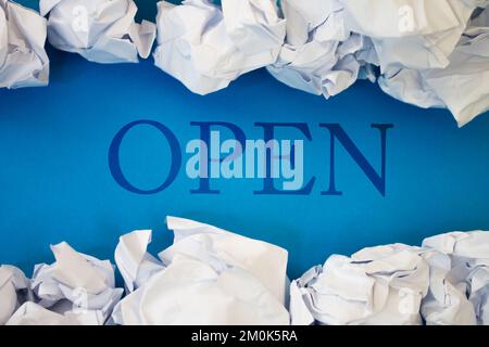 Open text with Torn, Crumpled White Paper on colored background. Stock Photo