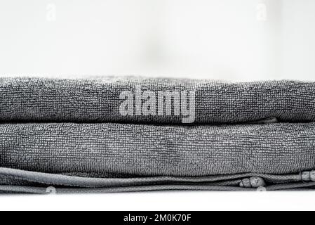 Close up gray towels in white background Stock Photo