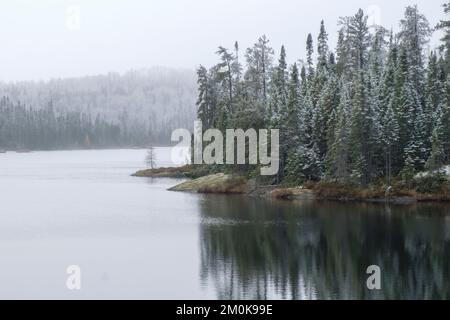 Early frost at a scenic roadside lake next to highway 17 in northern Ontario, Canada Stock Photo