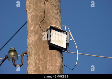 The LED street light is attached to a wooden pole Stock Photo