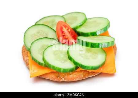 Crispy Cracker Sandwich with Fresh Cucumber, Tomato Cherry and Cheese - Isolated on White. Easy Breakfast. Quick and Healthy Sandwich. Crispbread with Tasty Filling. Healthy Dietary Snack - Isolation Stock Photo