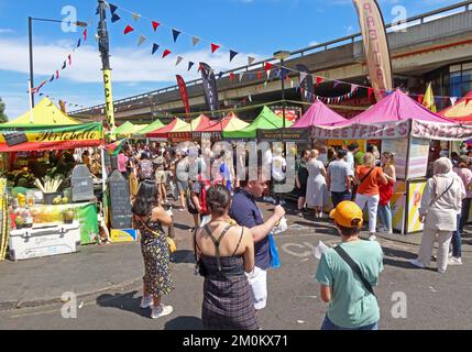 Acklam food market, Portobello Road busy world food stalls, under The Westway flyover, Notting Hill, RBKC, London, England, UK, W10 5TY Stock Photo