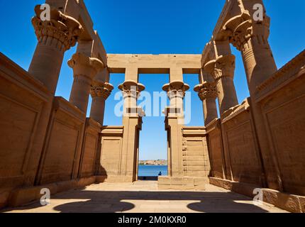 A scenic shot of the Philae temple complex against the blue sky in Egypt Stock Photo