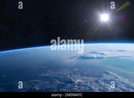 Earth, Sun and Space. Planet Earth with sunrise and nebula in the space.  Earth Observations. Elements of this image furnished by NASA. Stock Photo