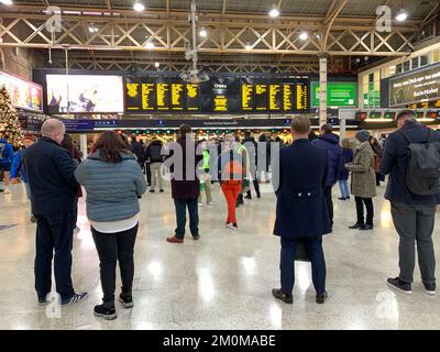 6th December, 2022. London Waterloo, UK. Commuters at Charing Cross Railway Station in London. Union leaders have rejected the lastest pay offer and so further rail strikes are planned to go ahead on 13-14 December 2022, 16-17 December and from 6pm on Christmas Eve until 6am on 27th December. Many travellers are starting to lose their patience with the rail strikes especially as it means many people will now not be able to go and visit family and friends over the Christmas period if the rail strikes go ahead. Credit: Maureen McLean/Alamy Live News Stock Photo